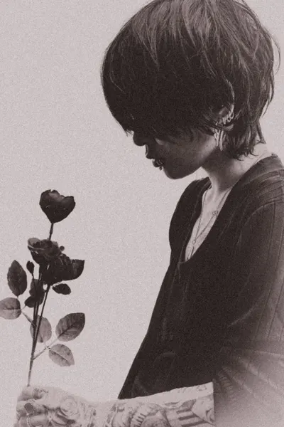 Woman Holding Dark Roses by Y