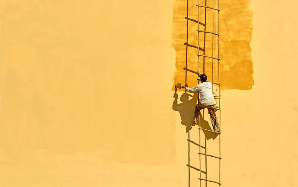 Man Painting Golden Wall by Anette Ohlendorf