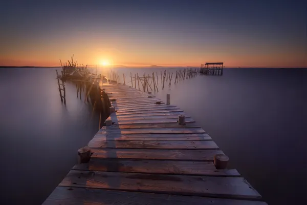 Golden Pier Sunset by Iván Ferrero