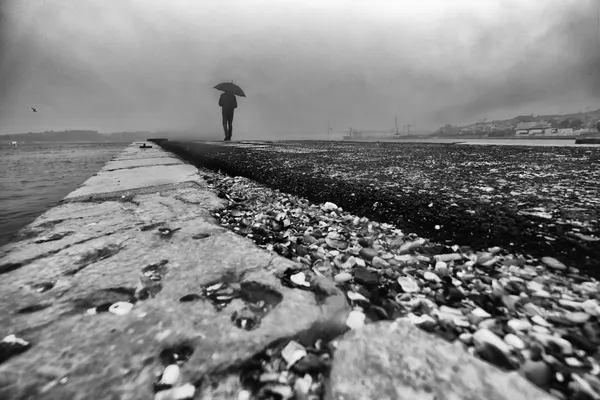 Solitary Man on Pier by Josefina Melo