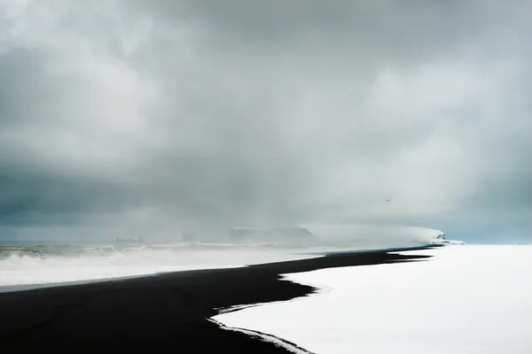 Dramatic Winter Black Beach by Adrian Theze