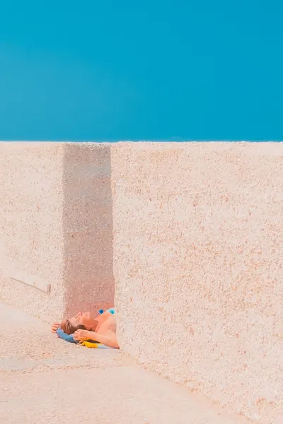 Blue Sky Sunbather by Roberto Ruoli