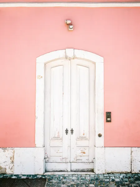 The white door Lisbon by Raisa Zwart