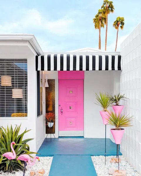 Pink Door with Yard Flamingos by Tom Windeknecht