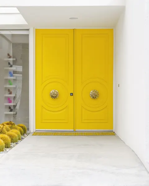 Canary Yellow Doors on a Mid-Century Modern by Tom Windeknecht