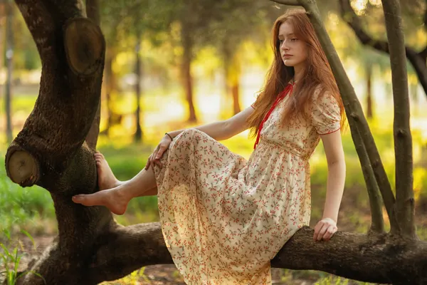 Redhead Girl on Branch by Tali Stein