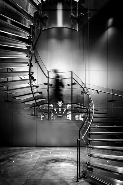 Blurred Figure Spiral Stairs by Hervé Loire