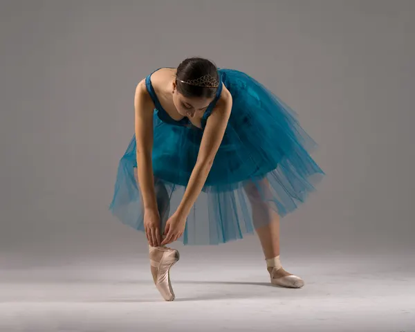 Ballerina Tying Pointe Shoes by Aneta Nikolova