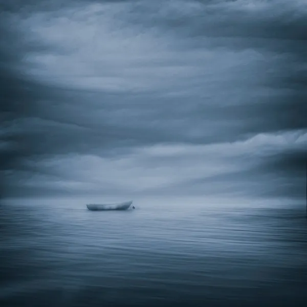 Solitary Boat Moody Sky by Joanna Maciszka