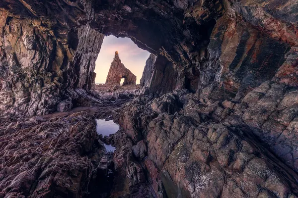 Dramatic Cave Archway by Iván Ferrero