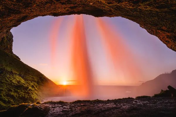 Sunset Waterfall Cave by Chengming