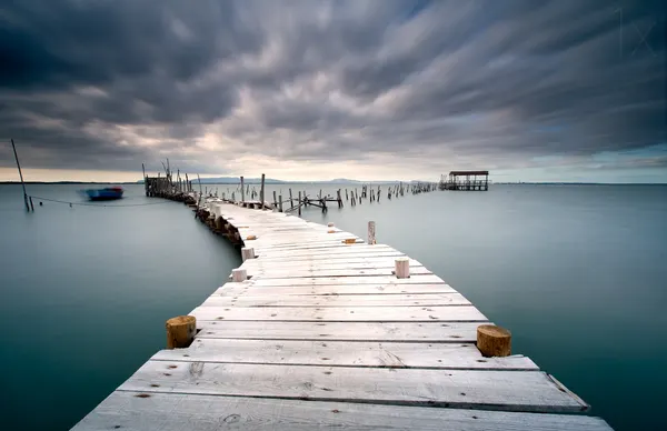 Moody Wooden Pier by Jorge Feteira