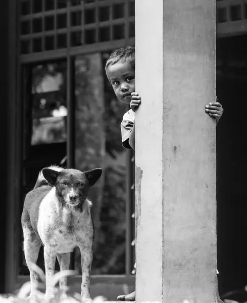 Peeking Boy And Dog by Ugur Erkmen