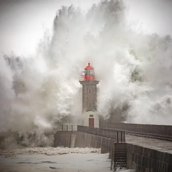 Lighthouse Amidst Crashing Waves by Marco Faria