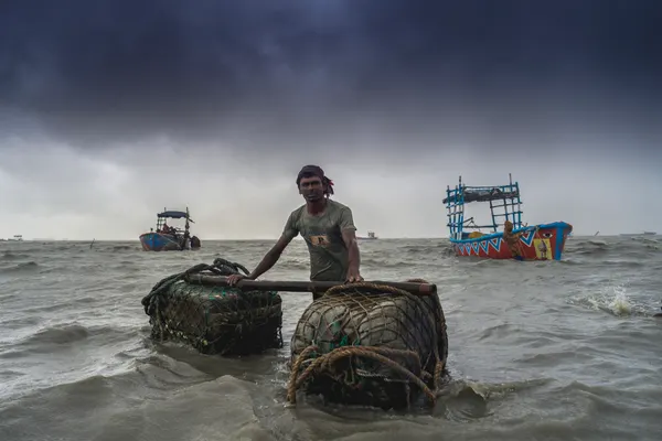 Working the Stormy Sea by Anisur Rahman