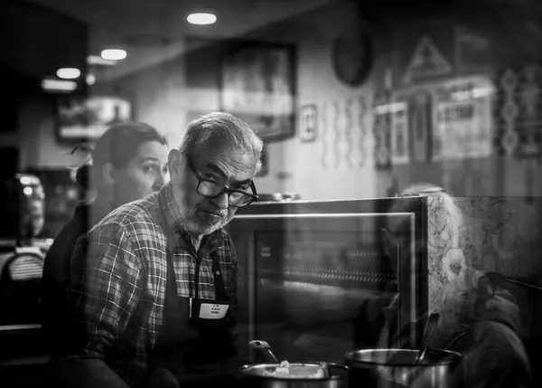 Candid Cafe Worker by Rudy Mareel