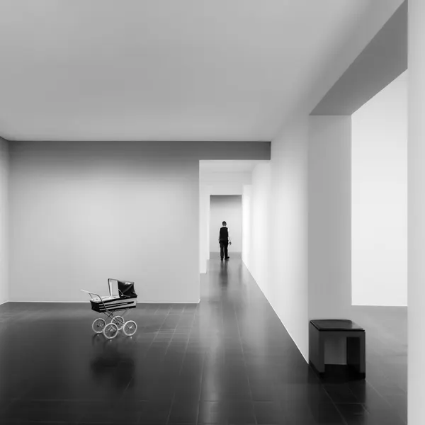 Man and Pram in Hallway by Andy Dauer