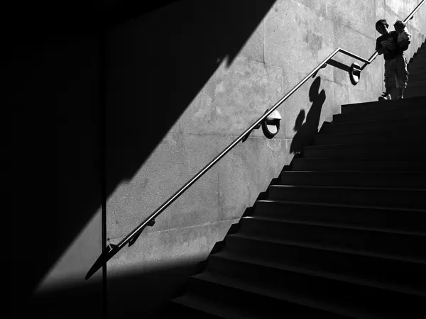 Boy on Shadowy Stairs by Carlos Costa