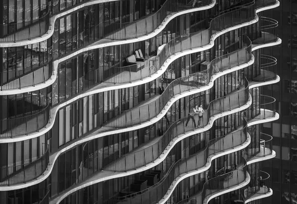 Dynamic Balcony Embrace by Marek Lapa
