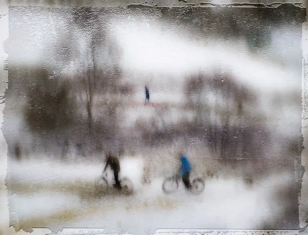 Blurred Winter Cyclists by Amer Jassim