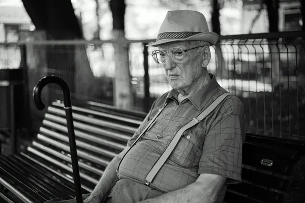 Old Man on Park Bench by Denis Malciu