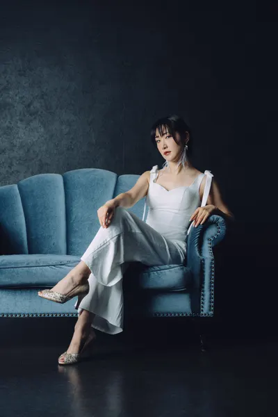 Confident Woman On Sofa by h112o1