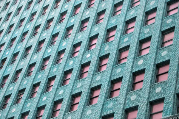 Brick Building with Pink Windows, wall art by Tom Windeknecht