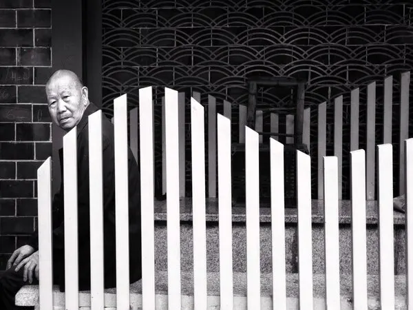 Elderly Man Behind Fence, wall art by Jasmine Zhang