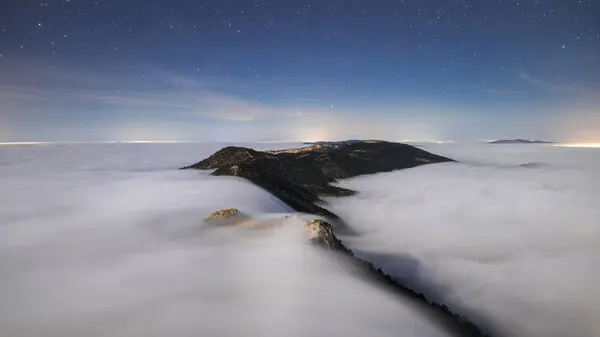 Starry Peaks Above Clouds, wall art by Andrei Ionut Dascalu