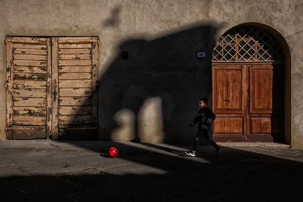 Boy Playing Street Soccer, wall art by Luca Domenichi