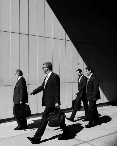 Businessmen Walking In Sunlight, wall art by Ivan Lesica